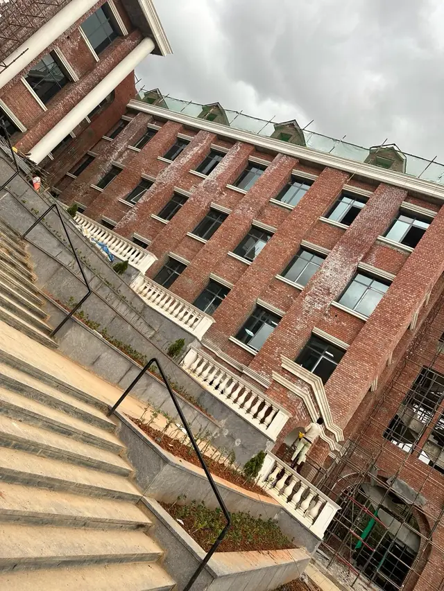 Balustrades stepping down beside the main stairs