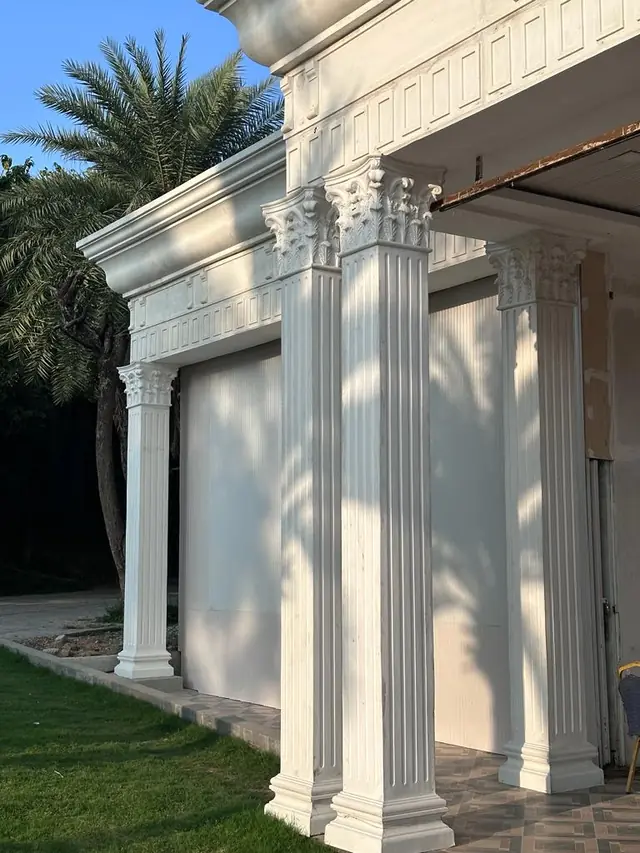 Paired columns with ornate capitals at the corner of the building