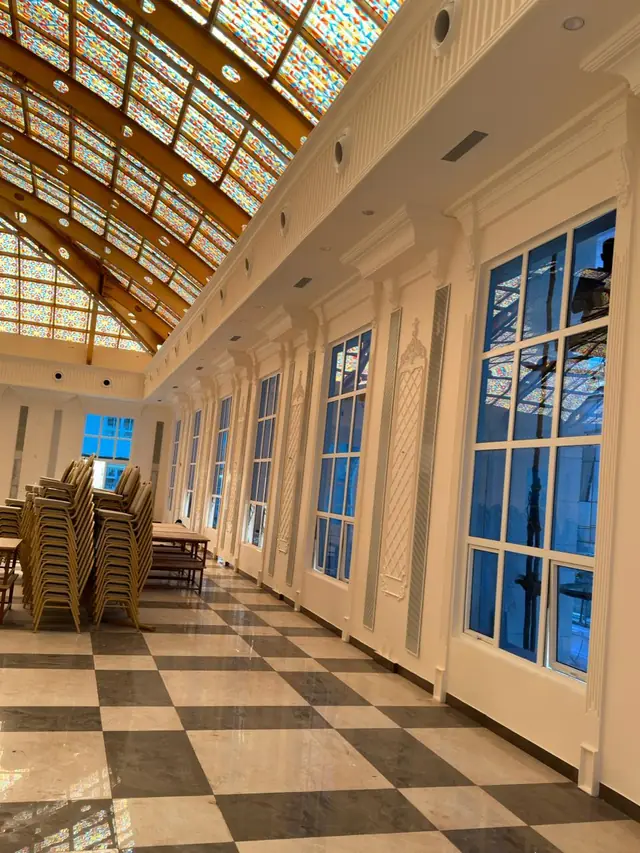 Pilasters and window surrounds along the hall wall